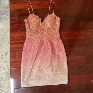 I am selling a prom dress that is size 4 only worn once. The design is jovani.